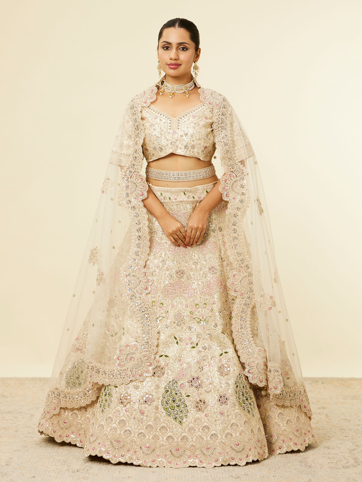 alt message - Mohey Women Dark Cream Floral Patterned Lehenga with Peacock Motifs image number 0